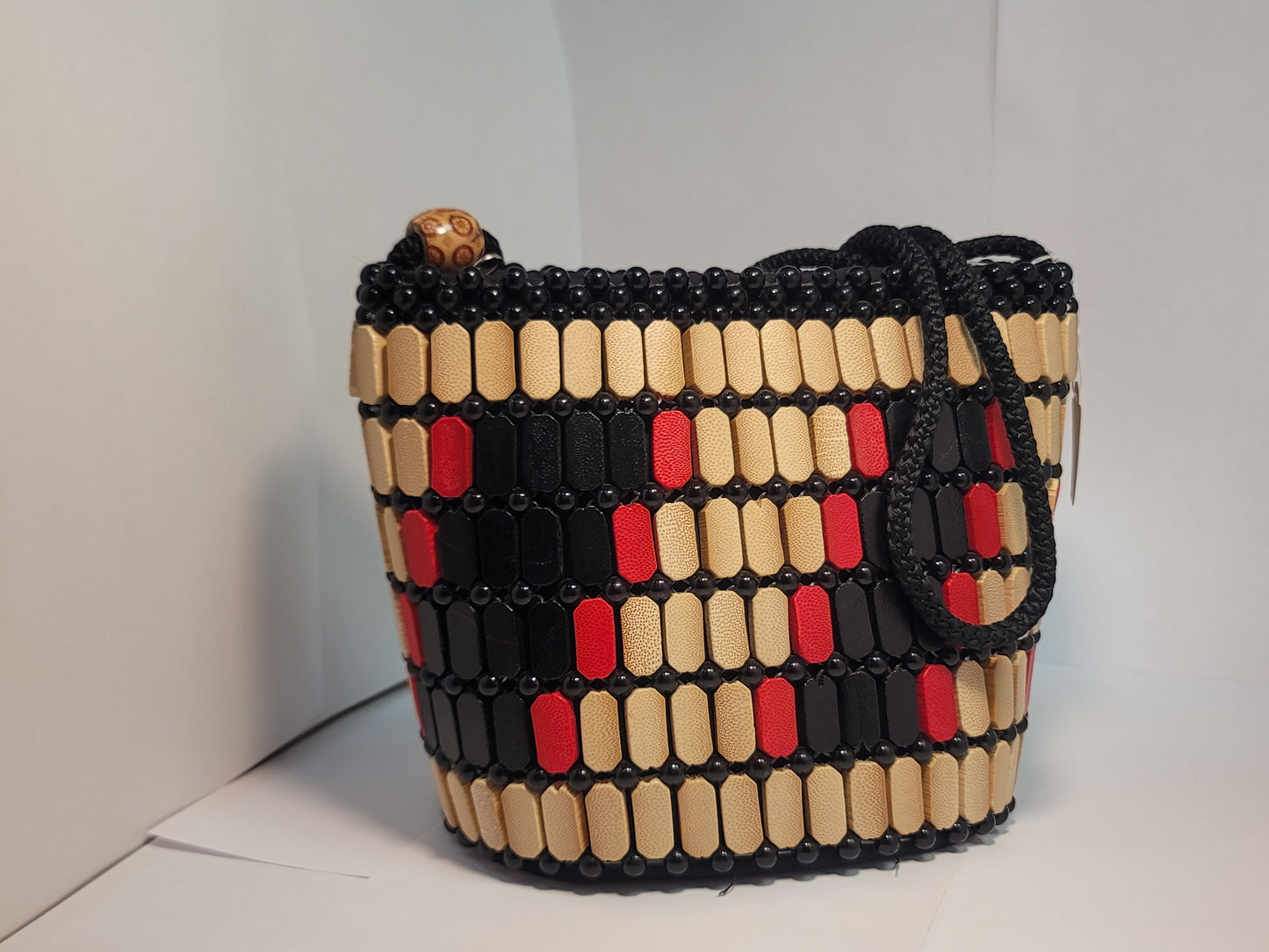 African women's wood art purse